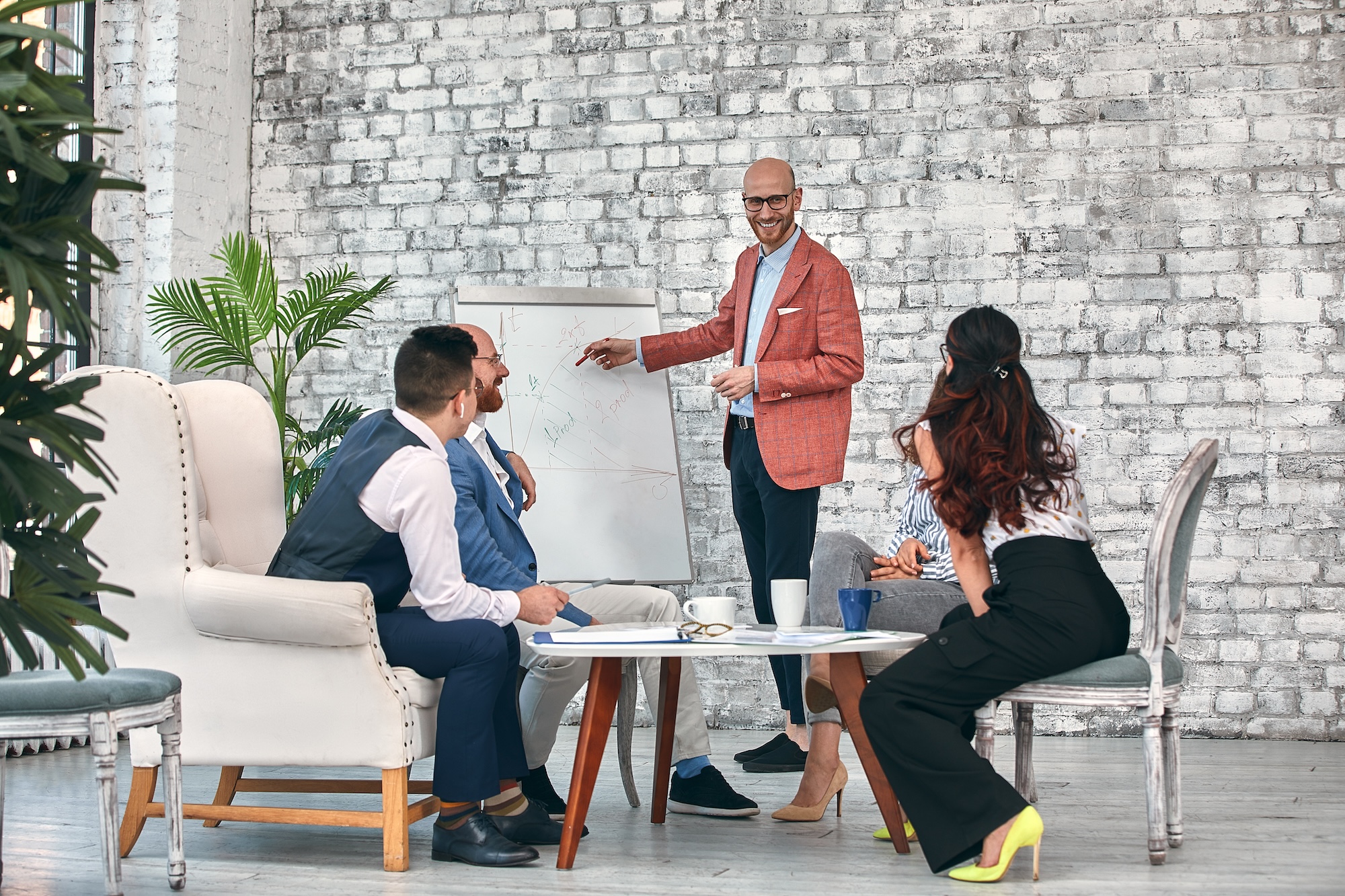 Marketing leader walking a small B2B team through challenger brand positioning and villain definition